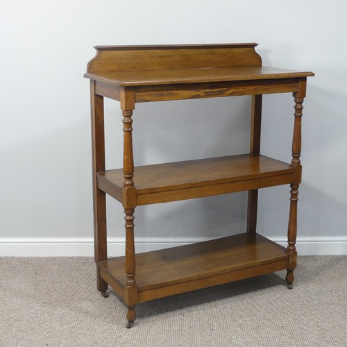 489 - An Edwardian oak three-tier serving Buffet, with turned supports, W 100cm x D 44cm x H 122cm.... 