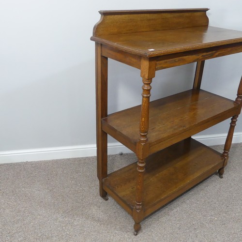 489 - An Edwardian oak three-tier serving Buffet, with turned supports, W 100cm x D 44cm x H 122cm.... 