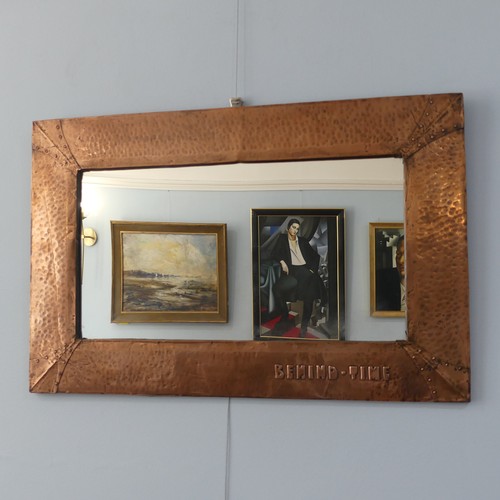 491 - An Arts and Crafts copper framed rectangular Wall Mirror, hammered and riveted surround with motto '... 