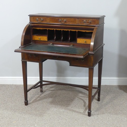 498 - An Edwardian inlaid mahogany roll-top Bureau, having a three drawer section top over roll top openin... 