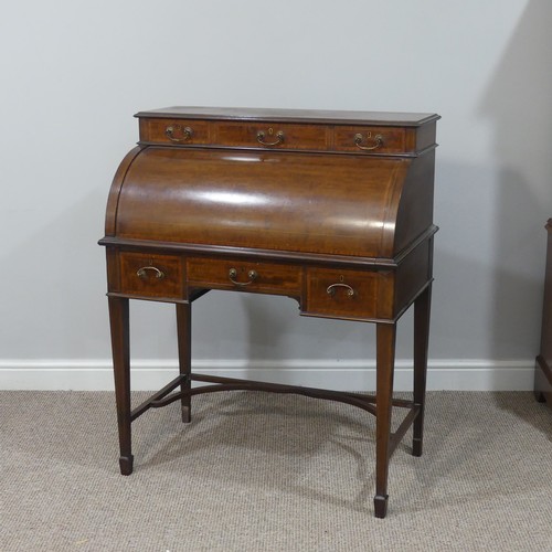 498 - An Edwardian inlaid mahogany roll-top Bureau, having a three drawer section top over roll top openin... 