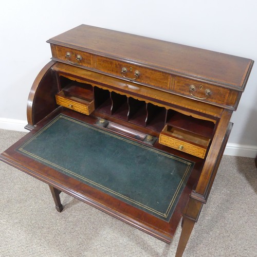 498 - An Edwardian inlaid mahogany roll-top Bureau, having a three drawer section top over roll top openin... 