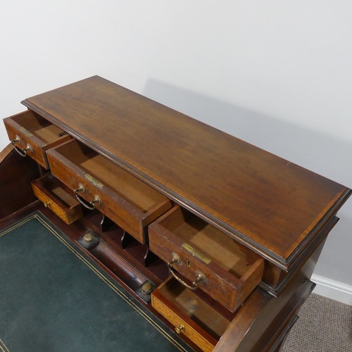 498 - An Edwardian inlaid mahogany roll-top Bureau, having a three drawer section top over roll top openin... 