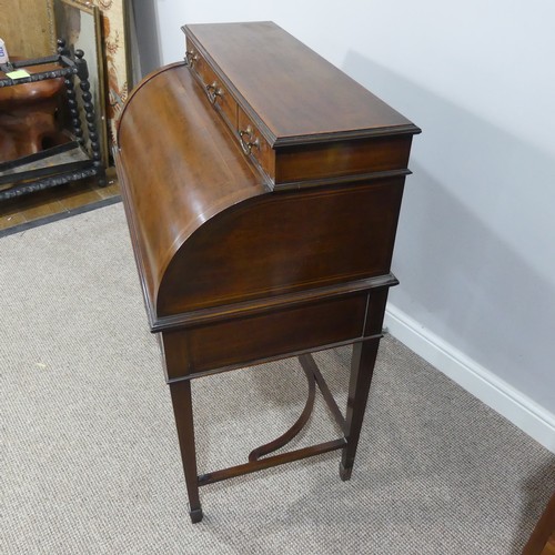 498 - An Edwardian inlaid mahogany roll-top Bureau, having a three drawer section top over roll top openin... 