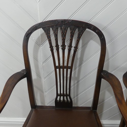 515 - A set of six Regency-style Dining Chairs with two Carvers, the shaped back with leaf and flower carv... 