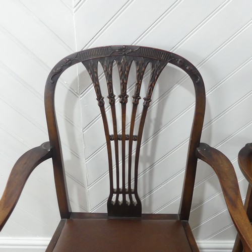 515 - A set of six Regency-style Dining Chairs with two Carvers, the shaped back with leaf and flower carv... 