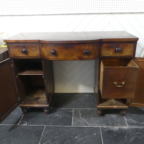 516 - A Georgian mahogany pedestal Sideboard, the shaped top above three frieze drawers and two cupboards,... 