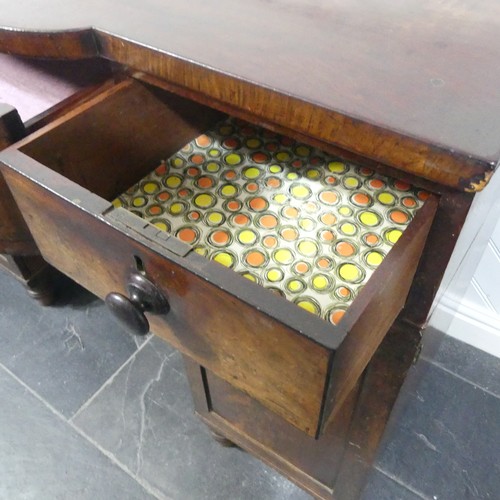 516 - A Georgian mahogany pedestal Sideboard, the shaped top above three frieze drawers and two cupboards,... 