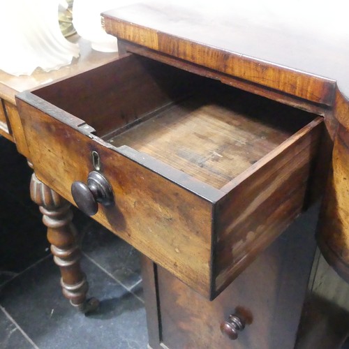 516 - A Georgian mahogany pedestal Sideboard, the shaped top above three frieze drawers and two cupboards,... 