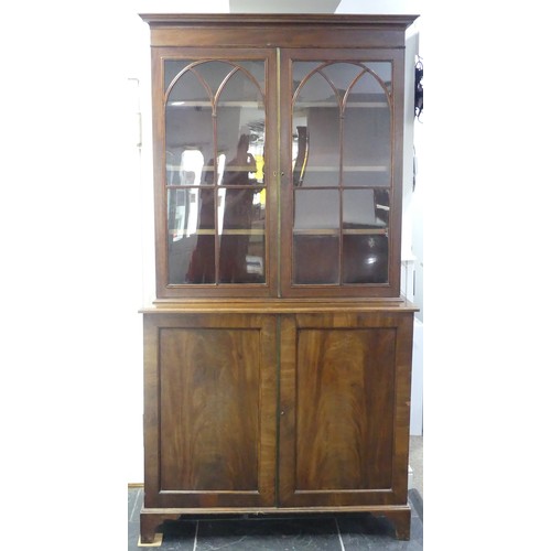 517 - A George III mahogany astragal glazed Bookcase, the moulded cornice above two glazed doors, enclosin... 