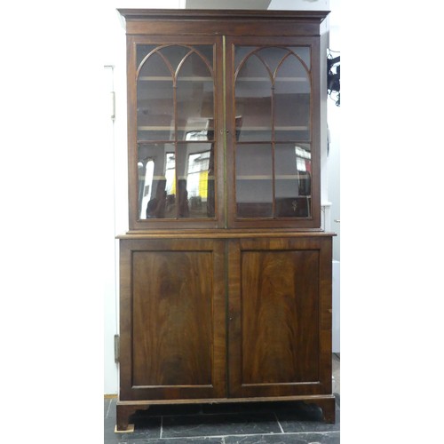 517 - A George III mahogany astragal glazed Bookcase, the moulded cornice above two glazed doors, enclosin... 