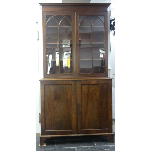 517 - A George III mahogany astragal glazed Bookcase, the moulded cornice above two glazed doors, enclosin... 