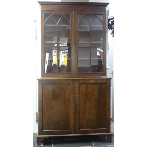 517 - A George III mahogany astragal glazed Bookcase, the moulded cornice above two glazed doors, enclosin... 