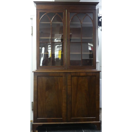 517 - A George III mahogany astragal glazed Bookcase, the moulded cornice above two glazed doors, enclosin... 