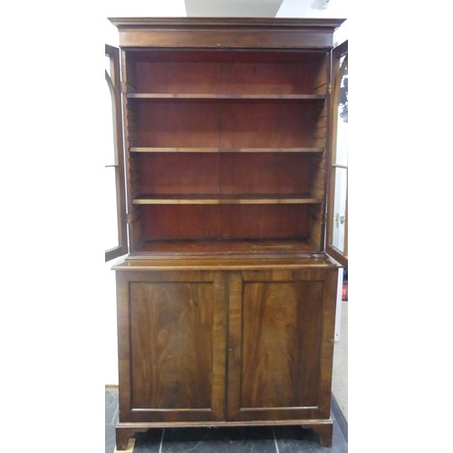 517 - A George III mahogany astragal glazed Bookcase, the moulded cornice above two glazed doors, enclosin... 