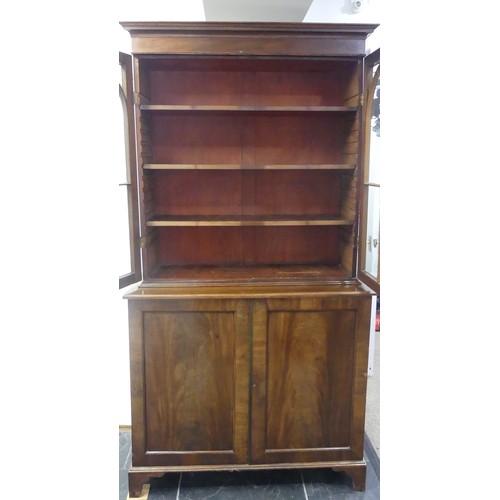 517 - A George III mahogany astragal glazed Bookcase, the moulded cornice above two glazed doors, enclosin... 