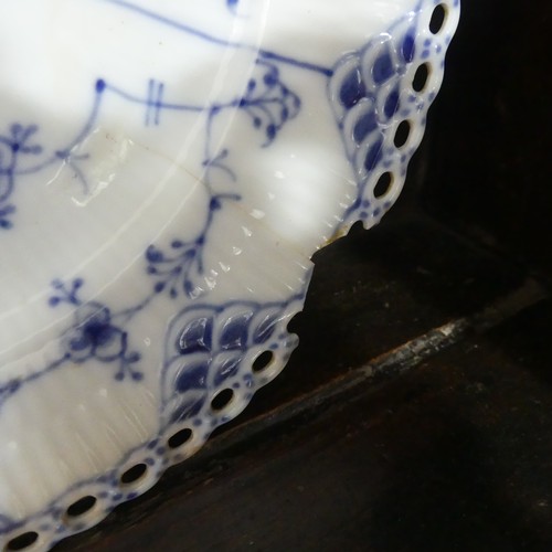 87 - An extensive Royal Copenhagen blue and white fluted lace pattern Dinner Service, comprising twelve P... 