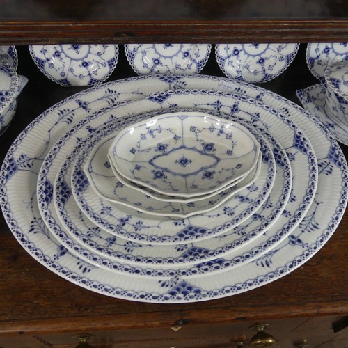 87 - An extensive Royal Copenhagen blue and white fluted lace pattern Dinner Service, comprising twelve P... 