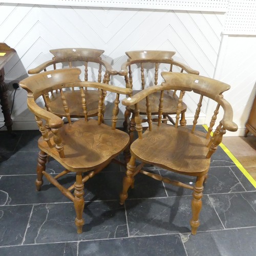 534 - A set of eight elm and beech Smokers Bow Chairs, with turned spindles, shaped seat and H stretcher (... 