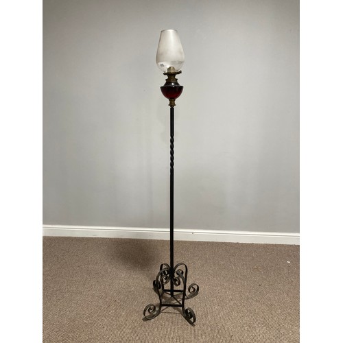 362 - A wrought iron and red glass standard Lamp Stand with Oil Lamp, the red glass lamp with opaque glass... 