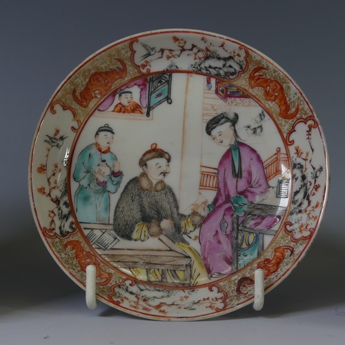 4 - An antique Oriental porcelain Tea Bowl and Saucer, decorated with figures in interior scenes, unmark... 