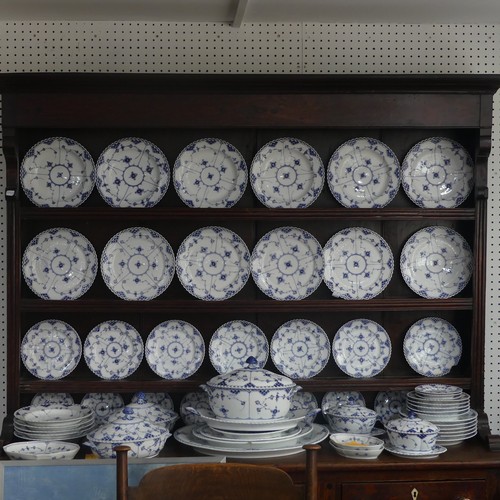 87 - An extensive Royal Copenhagen blue and white fluted lace pattern Dinner Service, comprising twelve P... 