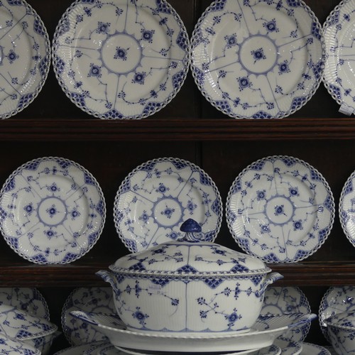 87 - An extensive Royal Copenhagen blue and white fluted lace pattern Dinner Service, comprising twelve P... 