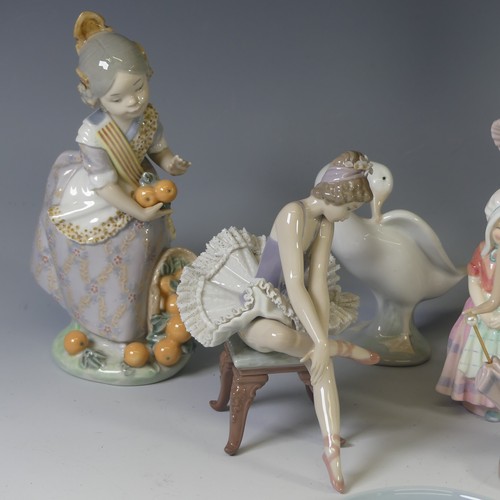 92 - A Lladro figure of 'Ms Valencia', modelled with a basket of oranges, together with a Lladro figure o... 