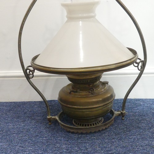 304 - An early 20thC brass Hanging Oil Lamp, of bell shape with floral scroll and Greek key decoration, op... 