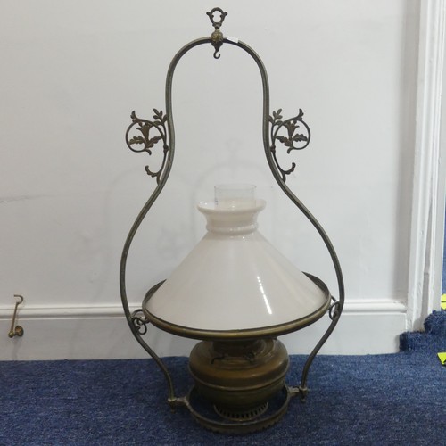 304 - An early 20thC brass Hanging Oil Lamp, of bell shape with floral scroll and Greek key decoration, op... 