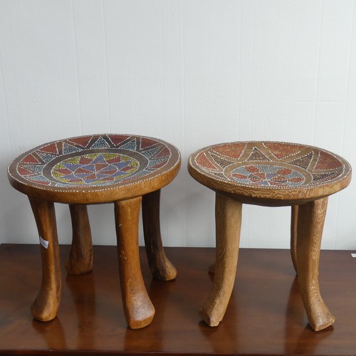 318 - An early 20thC Kenyan hardwood dished Stool, the top inset with geometric beadwork, on four legs wit... 