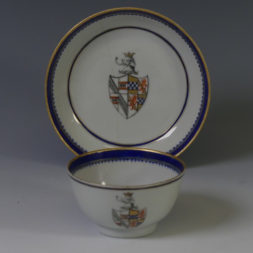 144 - An 18thC Chinese export armorial porcelain Teabowl and Saucer, decorated with gilt and blue banding ... 