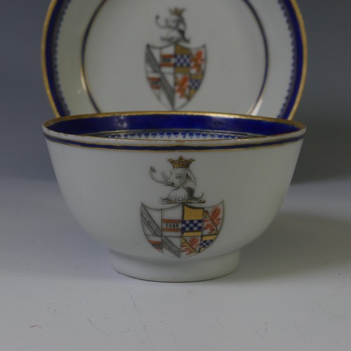 144 - An 18thC Chinese export armorial porcelain Teabowl and Saucer, decorated with gilt and blue banding ... 