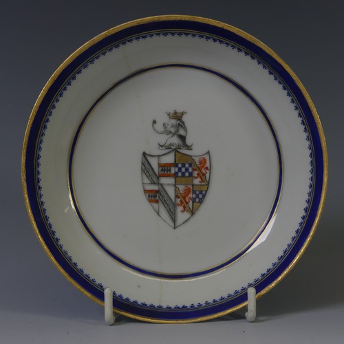 144 - An 18thC Chinese export armorial porcelain Teabowl and Saucer, decorated with gilt and blue banding ... 