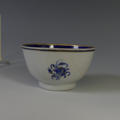 144 - An 18thC Chinese export armorial porcelain Teabowl and Saucer, decorated with gilt and blue banding ... 