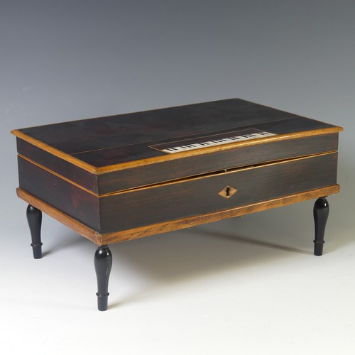 A 19th century Palais Royale style rosewood and ivory inlaid musical Necessaire, in the form of a square piano, the hinged top opening to reveal a mirror and red velvet-lined tray with part fittings, W:29cm x D:19cm x H:14cm.  DEFRA Ivory Act submission ref: BT3UHRTE
