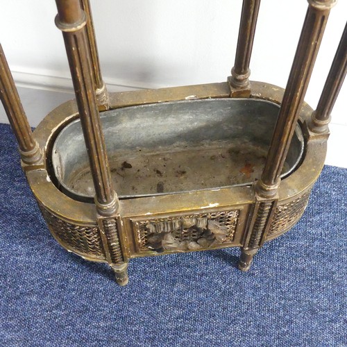 314 - An early 20thC French giltwood Plant Stand, the oval hardstone top, above a metal lined cane work un... 