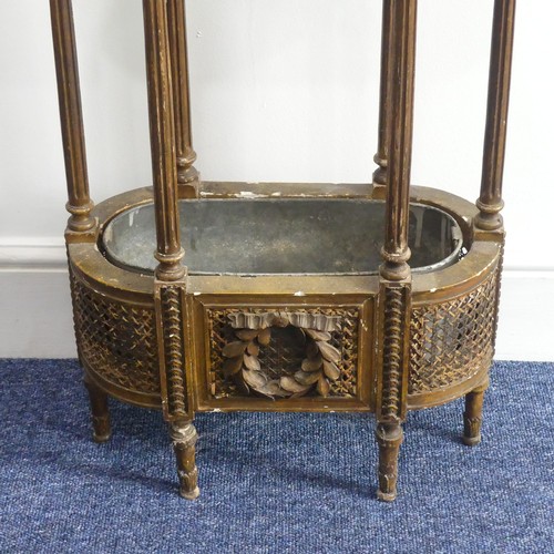 314 - An early 20thC French giltwood Plant Stand, the oval hardstone top, above a metal lined cane work un... 