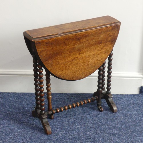 316 - A Victorian walnut 'bobbin' Sutherland Table, the oval top raised on bobbin turned supports with cas... 