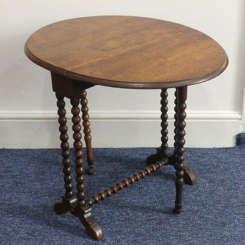 316 - A Victorian walnut 'bobbin' Sutherland Table, the oval top raised on bobbin turned supports with cas... 