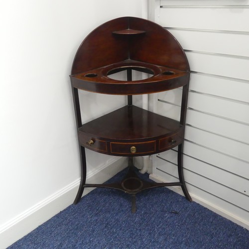 321 - A Georgian mahogany corner Washstand, with one drawer and two dummy drawers, raised on splayed legs,... 