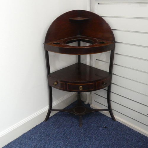 321 - A Georgian mahogany corner Washstand, with one drawer and two dummy drawers, raised on splayed legs,... 