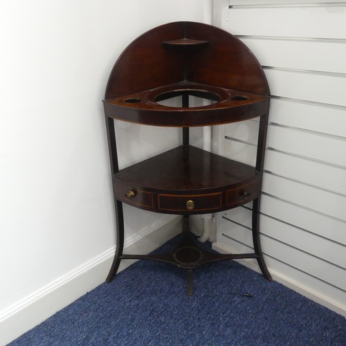 321 - A Georgian mahogany corner Washstand, with one drawer and two dummy drawers, raised on splayed legs,... 