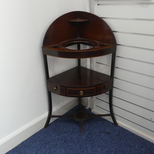 321 - A Georgian mahogany corner Washstand, with one drawer and two dummy drawers, raised on splayed legs,... 