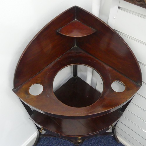 321 - A Georgian mahogany corner Washstand, with one drawer and two dummy drawers, raised on splayed legs,... 