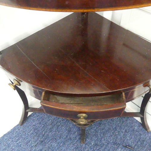 321 - A Georgian mahogany corner Washstand, with one drawer and two dummy drawers, raised on splayed legs,... 