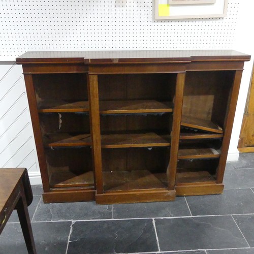 538 - A Victorian mahogany breakfront Bookcase, the open adjustable shelves with leather dust covers, all ... 