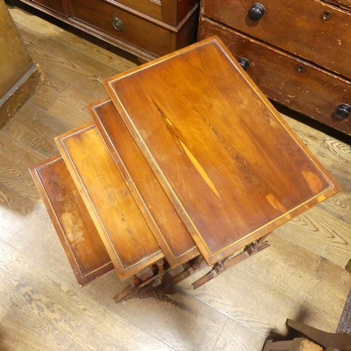 537 - A mahogany Nest of four Tables, raised on moulded legs and sledge feet, the largest: W 59cm x D 38cm... 