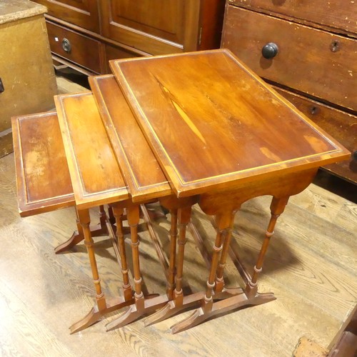 537 - A mahogany Nest of four Tables, raised on moulded legs and sledge feet, the largest: W 59cm x D 38cm... 