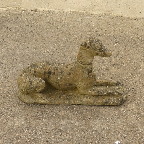 278 - Garden Statuary; A vintage reconstituted stone Dog, modelled laying on front legs, L 66cm x W 27cm x... 